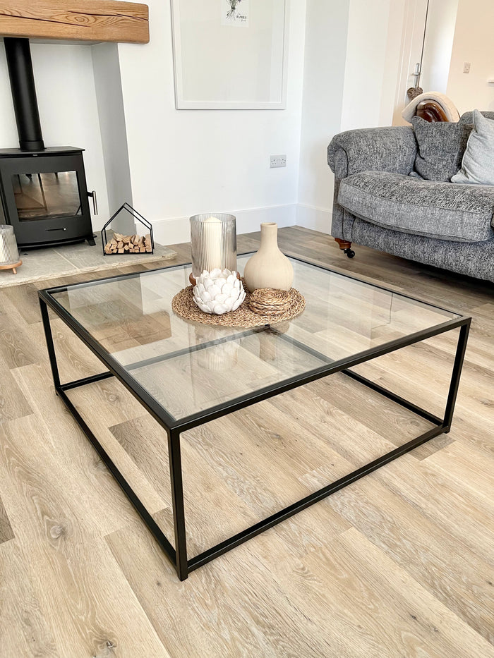 dark bronze metal framed glass top coffee table