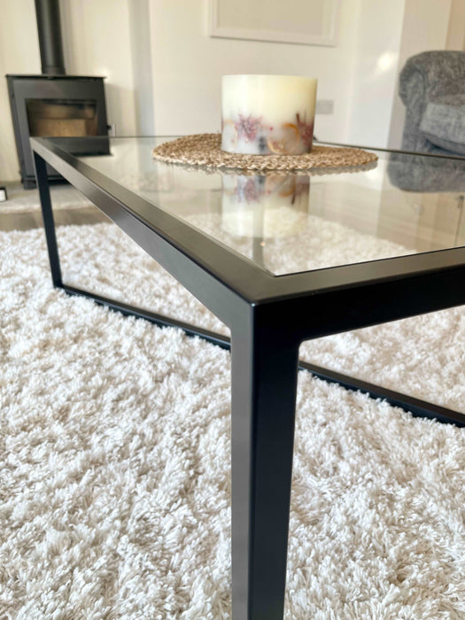 Glass and Black Metal Coffee Table